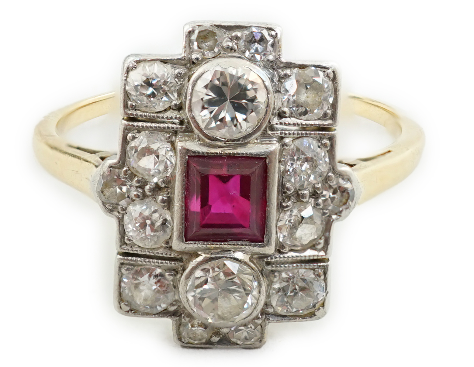 A 1920's gold and millegrain set ruby and diamond cluster dress ring